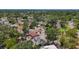 Aerial view showing surrounding neighborhood and mature tropical landscaping at 922 Alcazar S Way, St Petersburg, FL 33705