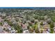 Aerial view showing surrounding neighborhood, mature trees and tropical landscaping at 922 Alcazar S Way, St Petersburg, FL 33705