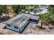 Aerial view of a single-story home, featuring a screen porch, and tropical landscaping at 922 Alcazar S Way, St Petersburg, FL 33705