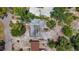 Aerial view of a single-story home featuring mature trees and tropical landscaping at 922 Alcazar S Way, St Petersburg, FL 33705
