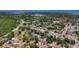 The aerial view displays the layout of the streets and the community surrounded by nature at 922 Alcazar S Way, St Petersburg, FL 33705