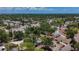 Aerial view of a neighborhood near the coast, showcasing the houses with a clear blue sky backdrop at 922 Alcazar S Way, St Petersburg, FL 33705
