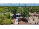 An aerial view showing a home with mature trees, and a driveway, in an established neighborhood at 922 Alcazar S Way, St Petersburg, FL 33705