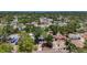 This aerial showcases a neighborhood with lush greenery providing a sense of privacy to the homes at 922 Alcazar S Way, St Petersburg, FL 33705