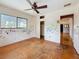Bedroom with hardwood floors, ceiling fan, closet and a view from the window at 922 Alcazar S Way, St Petersburg, FL 33705