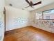 Bedroom with hardwood floors, ceiling fan, closet and a view from the window at 922 Alcazar S Way, St Petersburg, FL 33705