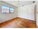 Bedroom features hardwood floors, ceiling fan, and natural light at 922 Alcazar S Way, St Petersburg, FL 33705