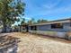 Charming single-story home with blue and white painted brick and nicely trimmed landscaping at 922 Alcazar S Way, St Petersburg, FL 33705