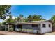 Charming single-story home with blue and white painted brick and nicely trimmed landscaping at 922 Alcazar S Way, St Petersburg, FL 33705