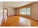 Spacious living room featuring gleaming hardwood floors and natural light with neutral walls ready for personal touches at 922 Alcazar S Way, St Petersburg, FL 33705