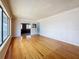 Bright living room featuring hardwood floors and large picture window with views to the exterior of the home at 922 Alcazar S Way, St Petersburg, FL 33705