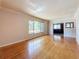 Spacious living room with hardwood floors and a large window for natural light at 922 Alcazar S Way, St Petersburg, FL 33705