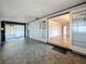 Bright sunroom featuring tile flooring, a view to the backyard, and glass paneled doors to other rooms at 922 Alcazar S Way, St Petersburg, FL 33705