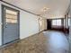 Bright sun room with view of adjacent rooms; featuring paneled doors and gray trim on the doorways and windows at 922 Alcazar S Way, St Petersburg, FL 33705