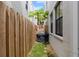 Narrow backyard with grill, grass and wood fence at 109 S Packwood Ave # B, Tampa, FL 33606