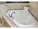 Close up of bathroom soaking tub with marble accents at 109 S Packwood Ave # B, Tampa, FL 33606