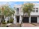 Charming two-story home features a balcony, columns, and a two-car garage at 109 S Packwood Ave # B, Tampa, FL 33606