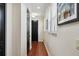 Hallway with dark wood floors and white walls and trim at 109 S Packwood Ave # B, Tampa, FL 33606