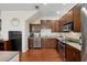 Modern kitchen features stainless steel appliances, granite countertops, and ample cabinet space at 109 S Packwood Ave # B, Tampa, FL 33606