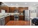 Modern kitchen features stainless steel appliances, granite countertops, and ample cabinet space at 109 S Packwood Ave # B, Tampa, FL 33606
