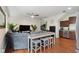 Inviting living area with hardwood floors, neutral tones, bar seating and open to stainless kitchen at 109 S Packwood Ave # B, Tampa, FL 33606