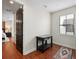 A small office with an area rug, window with blinds, and small dark wood desk at 109 S Packwood Ave # B, Tampa, FL 33606