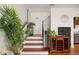 Staircase features wooden steps, iron railing, and leads to the upper level of the home at 109 S Packwood Ave # B, Tampa, FL 33606