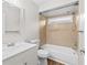 Renovated bathroom features ceramic tile detail, updated vanity, and shower-over-tub combination at 10900 Livingston Dr, New Port Richey, FL 34654