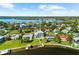 Luxury waterfront property featuring a pool, lush landscaping, and private boat dock, with beautiful water views at 110 Carlyle Dr, Palm Harbor, FL 34683