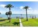 Backyard featuring water views with dock and beachfront at 110 Carlyle Dr, Palm Harbor, FL 34683