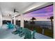 Balcony with rocking chairs and a beautiful view of the waterfront at sunset at 110 Carlyle Dr, Palm Harbor, FL 34683