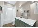 Well-lit bathroom with a shower-tub combo, updated vanity, and contemporary fixtures at 110 Carlyle Dr, Palm Harbor, FL 34683