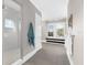 Bright bathroom with white shower, tile floors, and bright window with bench seat at 110 Carlyle Dr, Palm Harbor, FL 34683