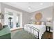 Cozy bedroom offering balcony access with water views, alongside unique decor and furnishings at 110 Carlyle Dr, Palm Harbor, FL 34683