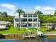 Stunning waterfront home with a private dock and a backyard oasis, perfect for entertaining at 110 Carlyle Dr, Palm Harbor, FL 34683