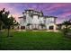 Stunning multi-story home with lush lawn, two garages, and inviting entryway at 110 Carlyle Dr, Palm Harbor, FL 34683