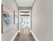 Hallway leading to a bedroom with water views and a sitting area at 110 Carlyle Dr, Palm Harbor, FL 34683