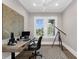 A well-lit home office with a telescope and a view of the outdoors from the bright windows at 110 Carlyle Dr, Palm Harbor, FL 34683