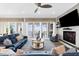 Relaxing living space with water views, stylish fireplace, and comfortable seating arrangement at 110 Carlyle Dr, Palm Harbor, FL 34683