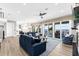 Open-concept living area with hardwood floors, views of the water, and contemporary furnishings at 110 Carlyle Dr, Palm Harbor, FL 34683