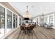Open floor plan showcasing the living room, dining area, and water views from sliding glass doors at 110 Carlyle Dr, Palm Harbor, FL 34683