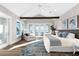 Bright main bedroom with vaulted ceilings, wood beams, and water views at 110 Carlyle Dr, Palm Harbor, FL 34683