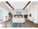 Spacious main bedroom with vaulted ceilings, wood beams, and serene decor at 110 Carlyle Dr, Palm Harbor, FL 34683