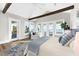 Tranquil main bedroom featuring vaulted ceilings, wood beams, and views of the water at 110 Carlyle Dr, Palm Harbor, FL 34683