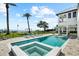 Beautiful backyard with a modern pool, spa, and bay views, perfect for relaxing and entertaining at 110 Carlyle Dr, Palm Harbor, FL 34683