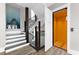 Modern staircase design alongside convenient lift access, illuminated by natural light at 110 Carlyle Dr, Palm Harbor, FL 34683