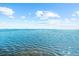 Expansive water view showcasing a bright blue open body of water under a partially cloudy sky at 110 Carlyle Dr, Palm Harbor, FL 34683