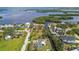 Aerial view of a quiet neighborhood by the bay; the home is nestled among lush, mature trees at 1110 Canal St, Ruskin, FL 33570
