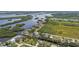 Aerial perspective showcases winding rivers, lush islands, nearby homes, and roads at 1110 Canal St, Ruskin, FL 33570