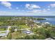 Aerial view of waterfront community surrounded by lush greenery under a partly cloudy sky at 1110 Canal St, Ruskin, FL 33570